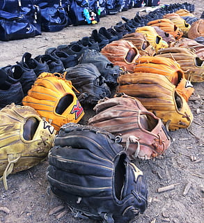 grove, baseball, tools, tool, sports, students, mitt, shoes, spike, otsu sports park, yokosuka, kanagawa, japan, antomasako, baseball game, black, yellow, goldenrod, brown, leather, back, mickey mouse, day, no people, high angle view, land, nature, outdoors, large group of objects, sunlight, field, still life, stack, abandoned, close-up, beach, abundance, solid, group, damaged, black color, shoe, junkyard, 2K, CC0, public domain, royalty free