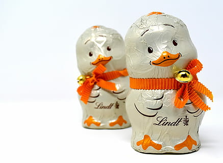 two, white, ceramic, penguin miniatures, top, table, chicks, chocolate, easter, delicious, lindt, sweetness, bell, nibble, temptation, food, candy, celebration, representation, halloween, trick or treat, no people, human representation, art and craft, holiday, food and drink, jack o' lantern, smiling, creativity, orange color, 4K, CC0, public domain, royalty free