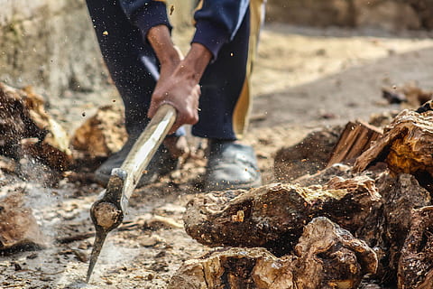 person, smashing, pick, axe, ground, action, bark, chopped, chopped wood, cut, firewood, hand, industry, lumber, man, outdoors, pickaxe, soil, Syria, timber, wood, one person, human hand, men, working, fire, fire - natural phenomenon, burning, human body part, occupation, heat - temperature, work tool, nature, day, preparation, meat, holding, food and drink, flame, campfire, bonfire, preparing food, 5K, CC0, public domain, royalty free