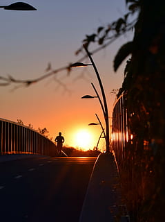 sunset, sun, sky, light, evening, yellow, orange, outdoor, color, spring, natural, summer, running, runner, run, alone, fitness, silhouette, orange color, nature, beauty in nature, real people, plant, tree, one person, scenics - nature, sunlight, lifestyles, men, transportation, outdoors, the way forward, street, 4K, CC0, public domain, royalty free