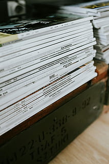 black-and-white, home decor, Contemporary, white home, interior, sofa, magazines, modern, table, pillows, bookcase, stylish, document, business, selective focus, no people, indoors, close-up, day, text, communication, book, paper, publication, still life, wood - material, western script, focus on foreground, education, stack, high angle view, script, non-western script, expertise, 5K, CC0, public domain, royalty free