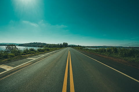 empty, road, daytime, near, body, water, nature, landscape, roads, paths, streets, ocean, sea, river, grass, sky, clouds, horizon, transportation, the way forward, road marking, diminishing perspective, day, no people, outdoors, symbol, marking, sign, direction, vanishing point, double yellow line, cloud - sky, empty road, highway, tranquility, tranquil scene, dividing line, long, 4K, CC0, public domain, royalty free