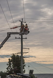 workers, men, linesmen, electricity, repair, maintenance, pole, cherry picker, wires, cables, energy, supply, voltage, power, electric, line, clouds, cloud - sky, sky, cable, occupation, working, power line, nature, sunset, power supply, connection, fuel and power generation, technology, real people, transportation, outdoors, mode of transportation, electricity pylon, telephone line, 2K, CC0, public domain, royalty free