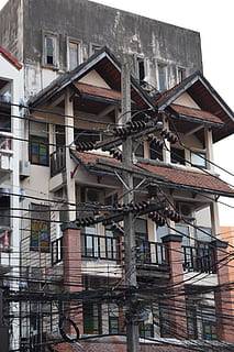 current, cable, strommast, energy, architecture, building exterior, built structure, building, residential district, low angle view, window, fire escape, no people, day, city, outdoors, staircase, railing, balcony, wall, emergency exit, house, steps and staircases, urgency, apartment, 1080P, CC0, public domain, royalty free