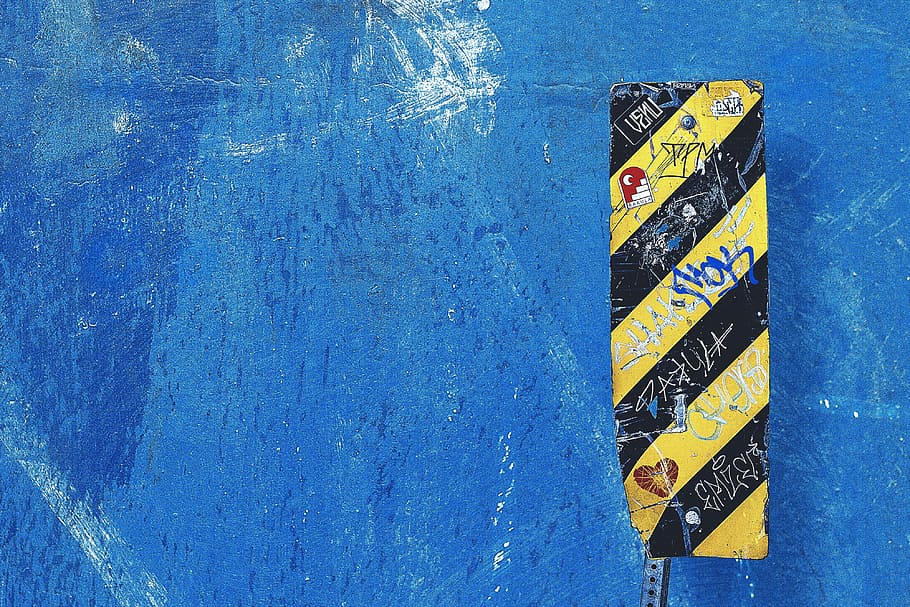 shot, blue, wall, sign, Closeup, blue wall, textures, text, no people, communication, water, day, western script, close-up, outdoors, guidance, high angle view, yellow, symbol, wall - building feature, direction, information, architecture, information sign, road, wood - material, 4K
