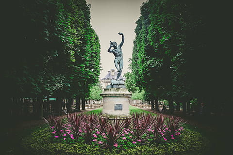 man statue, tall, trees, daytime, man, stone, statue, middle, park, building, green, plants, flower, people, men, sitting, bench, tree, sculpture, green color, no people, plant, park - man made space, outdoors, day, nature, architecture, human representation, art and craft, representation, growth, built structure, male likeness, sky, creativity, water, 5K, CC0, public domain, royalty free