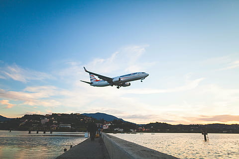 white, blue, airplane, flying, daytime, photo, air, plane, concrete, bridge, body, water, day, time, sky, clouds, airline, travel, trip, sea, ocean, people, walking, mountain, transportation, air vehicle, airport, journey, commercial airplane, mode of transportation, nature, sunset, cloud - sky, mid-air, architecture, motion, built structure, building exterior, outdoors, 5K
