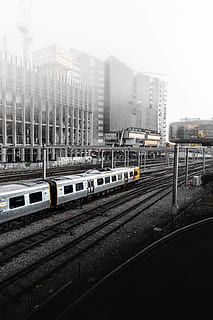 train, station, building, structure, infrastructure, architecture, construction, railway, transportation, building exterior, mode of transportation, rail transportation, built structure, city, public transportation, railroad track, track, train - vehicle, sky, no people, land vehicle, day, nature, motion, car, city life, outdoors, office building exterior, skyscraper, 5K, CC0, public domain, royalty free