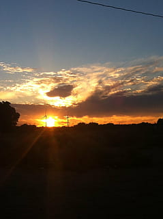 clouds, blue, sky, sun, baker ca, sunset, scenics - nature, tranquility, tranquil scene, beauty in nature, cloud - sky, environment, silhouette, orange color, tree, landscape, nature, sunlight, idyllic, no people, plant, non-urban scene, land, outdoors, 2K, CC0, public domain, royalty free