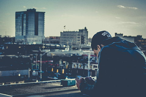 man, wearing, blue, denim jacket, looking, grey, city, black, jacket, cap, guy, texting, iphone, smartphone, cell phone, technology, people, lifestyle, urban, buildings, hat, only men, one person, adults only, one man only, city life, side view, adult, building exterior, cityscape, built structure, architecture, communication, sky, hood, clothing, hood - clothing, hooded shirt, focus on foreground, waist up, nature, outdoors, profile view, 4K, CC0, public domain, royalty free