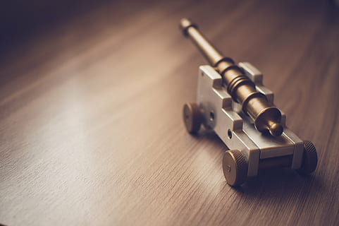 gray, brown, cannon, miniature, surface, canon, toy, objects, wood, no people, indoors, day, table, wood - material, security, single object, close-up, selective focus, weapon, high angle view, still life, focus on foreground, metal, equipment, protection, technology, copy space, writing instrument, safety, fountain pen, aggression, 1080P, CC0, public domain, royalty free