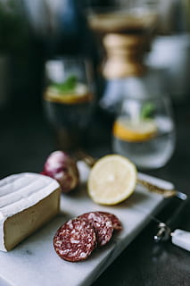 preparing, appetizer food, kitchen, appetizer, food, cheese, sausage, fruit, fruits, hands, lemon, vegetables, meat, gourmet, slice, close-up, freshness, food and drink, focus on foreground, indoors, healthy eating, table, citrus fruit, still life, selective focus, no people, wellbeing, kitchen knife, cutting board, preparation, preparing food, temptation, 5K