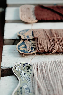close-up photography, brown, thread, three, threads, white, wood, vintage, spool, sewing, still life, no people, selective focus, indoors, close-up, table, textile, art and craft, craft, currency, large group of objects, finance, wood - material, paper currency, variation, creativity, choice, wool, high angle view, 4K, CC0, public domain, royalty free