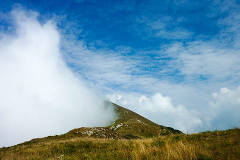clouds, mountain, sky, trail, grass, landscape, italy, cloud, dawn, weather, mountains, summit, vista, mountain landscape, light, nature, cloud - sky, scenics - nature, environment, beauty in nature, no people, non-urban scene, land, day, travel destinations, outdoors, smoke - physical structure, volcano, travel, tranquil scene, blue, volcanic crater, mountain peak, 2K, CC0, public domain, royalty free