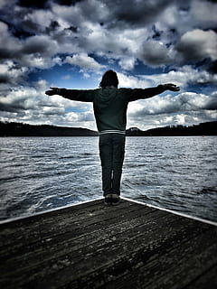 man, standing, body, water, sea, ocean, waves, nature, people, alone, silhouette, clouds, sky, dark, human arm, limb, arms raised, cloud - sky, human body part, rear view, arms outstretched, one person, adults only, leisure activity, real people, beauty in nature, casual clothing, lifestyles, scenics - nature, full length, freedom, human limb, outdoors, 4K, CC0, public domain, royalty free