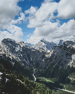 mountain range, cloudy, sky, daytime, aerial, photography, green, white, snow, capped, mountain, tree, cloud, pine, wood, peak, winding, river, valley, outdoor, hiking, cloud - sky, beauty in nature, scenics - nature, tranquil scene, environment, tranquility, nature, landscape, no people, winter, non-urban scene, cold temperature, day, idyllic, outdoors, snowcapped mountain, mountain peak, formation, range, 4K, CC0, public domain, royalty free