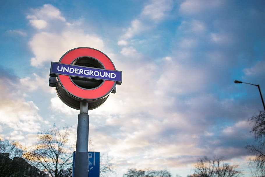 london, underground, side clouds, London Underground, Clouds, side, transport, sign, road Sign, warning Sign, outdoors, sky, communication, text, cloud - sky, road, low angle view, guidance, nature, no people, day, street, blue, pole, information, city, lighting equipment, western script, 2K