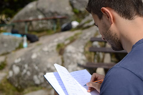 person, holding, notebook, writing, daytime, idea, notes, leave, memo, paper, conception, planning, note, design, concept, sketch, pen, write down, notepad, creativity, projects, strategy, young adult, one person, activity, men, young men, headshot, reading, side view, adult, looking, portrait, day, concentration, looking down, beard, outdoors, over the shoulder view, profile view, 5K, CC0, public domain, royalty free