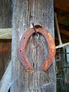 Luck, Horseshoe, Amulet, Rust, rusty, wood, post, nail, preached, suspended, farm, metal, iron, old, screw, wood - material, no people, day, weathered, abandoned, close-up, decline, deterioration, outdoors, run-down, textured, geometric shape, circle, damaged, brown, obsolete, shape, wheel, 2K, CC0, public domain, royalty free