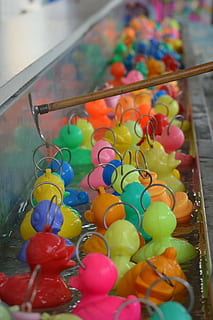 Colors, Ducklings, Funfair, multi colored, indoors, cultures, easter, large group of objects, close-up, still life, choice, selective focus, variation, no people, food, food and drink, representation, high angle view, focus on foreground, abundance, container, toy, celebration, animal representation, 4K, CC0, public domain, royalty free