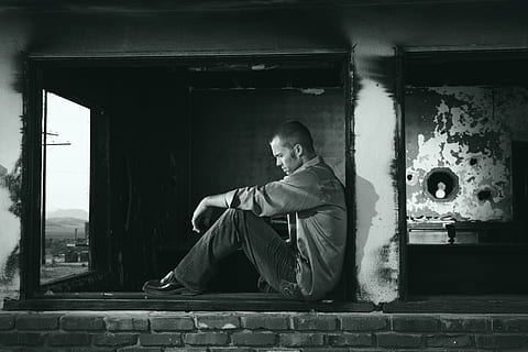 black-and-white, depressed, depression, lonely, man, person, sad, stress, thinking, unhappy, young, young man, one person, real people, sitting, architecture, lifestyles, built structure, men, adult, full length, day, males, casual clothing, leisure activity, building, side view, window, outdoors, architectural column, contemplation, teenager, 4K