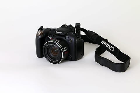 digitalkamera, kamera, canon, Power, sx1 er, kamera - fotografisk utstyr, utstyr, teknologi, enkelt objekt, fotografering temaer, objektiv - optisk instrument, studio skudd, hvit bakgrunn, svart farge, fotografisk utstyr, objektiv - øye, innendørs, skjære ut, kopiere plass, ingen folk, Film industri, slr kamera, tekst, fotografering, hjemme videokamera, 5K, CC0, offentlig domene, opphavsrett gratis