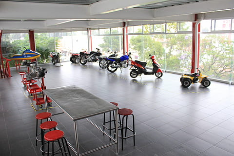 motorcycle, facilities, school, transportation, group of people, indoors, men, people, day, window, mode of transportation, real people, seat, women, adult, lifestyles, architecture, sitting, table, flooring, leisure activity, wheelchair, tiled floor, 2K, CC0, public domain, royalty free