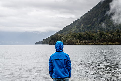 person, wearing, blue, hoodie, body, water, alone, back, back view, beach, clouds, daylight, fog, hill, hood, island, landscape, loneliness, man, mist, misty, mountain, nature, nature photography, ocean, outdoors, rain, rainy, rainy day, recreation, sea, seashore, travel, trees, waves, weather, rear view, beauty in nature, sky, scenics - nature, real people, one person, cloud - sky, tranquility, tranquil scene, lifestyles, hood - clothing, clothing, leisure activity, non-urban scene, day, looking at view, 4K, CC0, public domain, royalty free