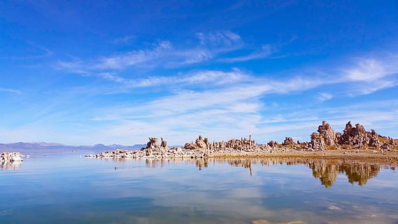 clouds, lake, landscape, nature, reflection, sky, water, sea, scenics - nature, architecture, cloud - sky, blue, no people, rock formation, rock, tranquility, rock - object, tranquil scene, travel destinations, beauty in nature, history, waterfront, solid, 1080P, CC0, public domain, royalty free