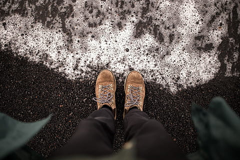 person, wearing, brown, shoes, black, pants, standing, asphalt road, asphalt, road, foams, gray, legs, shore, white, shoe, human Foot, human Leg, people, walking, low section, human body part, one person, body part, personal perspective, day, directly above, lifestyles, limb, high angle view, men, outdoors, nature, human limb, city, real people, jeans, 2K, CC0, public domain, royalty free