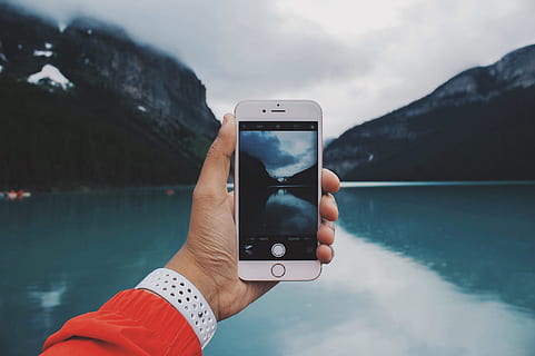 silver iphone 6, taking, picture, lake, cloudy, day, silver, iphone 6, hand, iphone, walke, holding, reflection, mountain, nature, outdoors, mobile Phone, landscape, water, one Person, human Hand, telephone, scenics, sky, winter, smart Phone, technology, vacations, mountain Range, women, people, wireless technology, communication, portable information device, photography themes, beauty in nature, human body part, scenics - nature, real people, 2K, CC0, public domain, royalty free