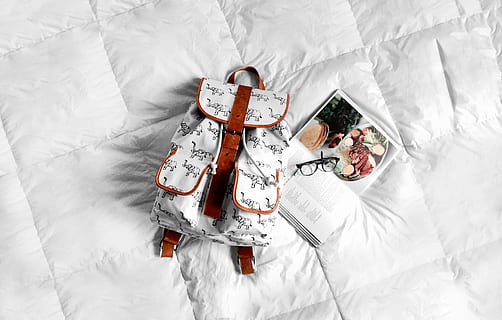 white, brown, leather backpack, textile, beside, book, bed, bag, backpack, glasses, lifestyle, travel, high angle view, bedroom, furniture, indoors, white color, domestic room, crumpled, sheet, directly above, no people, linen, lying down, winter, snow, pillow, lying on back, clothing, 2K, CC0, public domain, royalty free