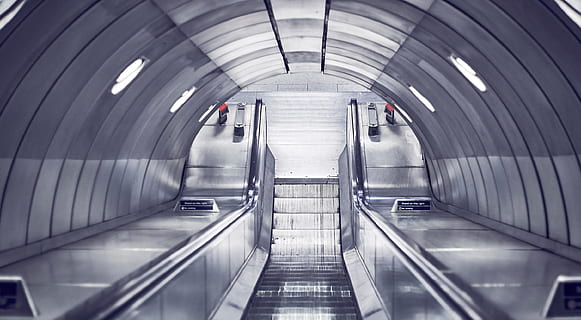 gray escalator, empty illuminated escalator, Going down, escalator, silver, grey, gray, stair, indoors, architecture, tunnel, station, inside Of, transportation, futuristic, subway Station, motion, blurred motion, modern, the way forward, direction, convenience, technology, railing, staircase, illuminated, moving walkway, built structure, people, adult, women, ceiling, 2K, CC0, public domain, royalty free