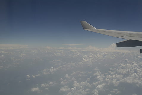 flight, cloud, the expanse, airplane, flying, air vehicle, sky, aircraft wing, transportation, mode of transportation, cloud - sky, mid-air, travel, no people, beauty in nature, day, nature, aerial view, blue, motion, scenics - nature, on the move, journey, outdoors, above, 4K, CC0, public domain, royalty free