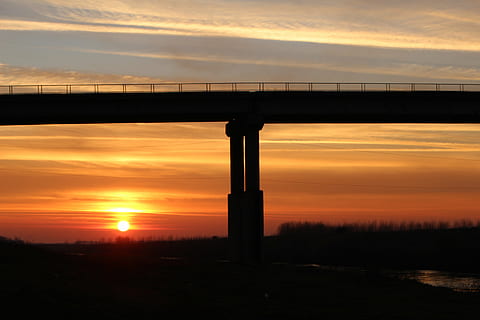 bridge, sun, red, sunset, sky, silhouette, cloud - sky, orange color, nature, built structure, scenics - nature, architecture, beauty in nature, no people, connection, tranquility, tranquil scene, outdoors, transportation, bridge - man made structure, dramatic sky, 5K, CC0, public domain, royalty free