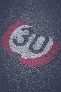 30 speed limit paint, road, thirty, 30, shield, mark, zone 30, speed limitation, note, zone, grey, caution, road sign, street sign, transportation, sign, communication, high angle view, no people, symbol, asphalt, red, day, number, marking, speed limit sign, road marking, city, street, close-up, shape, circle, 5K, CC0, public domain, royalty free