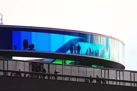 black, gray, concrete, building, view, group, people, standing, deck, architecture, structure, blue, light, men, women, shopping, mall, glass, bridge, built structure, modern, panoramic, building exterior, illuminated, no people, outdoors, day, sky, group of people, real people, adult, railing, lifestyles, crowd, city, leisure activity, 4K
