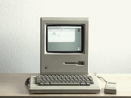 turned-on white computer, turned, computer, monitor, macintosh, technology, oldschool, vintage, retro, mouse, keyboard, indoors, computer keyboard, table, no people, wireless technology, close-up, computer key, day, wall - building feature, communication, connection, computer equipment, desktop pc, laptop, computer monitor, white color, furniture, desk, electrical equipment, 4K, CC0, public domain, royalty free