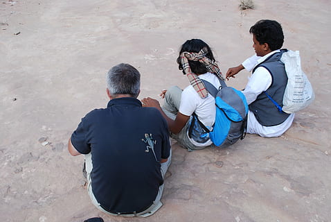 jordan, group, lizard, wait, human, male, resting, sitting on the floor, desert, men, full length, adult, sitting, one animal, rear view, high angle view, real people, males, people, vertebrate, pets, domestic animals, domestic, casual clothing, two people, mature adult, mature men, 4K, CC0, public domain, royalty free