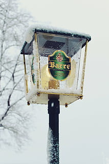 lantern, pub, light, snow, snowfall, snowy, winter, cold, ice, glass, lighting, lamp, light source, atmosphere, mood, bulbs, candlestick, hell, low angle view, no people, day, nature, sky, outdoors, clear sky, pole, human representation, representation, cold temperature, metal, focus on foreground, tree, close-up, birdhouse, plant, 4K, CC0, public domain, royalty free