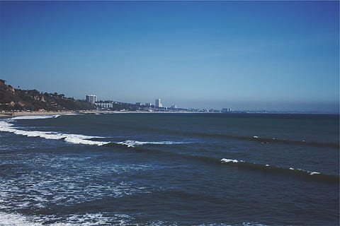 seawave during daytime, landscape, shot, ocean, daytime, beach, waves, sea, water, blue, sky, coast, nature, scenics, waterfront, tranquility, beauty in nature, outdoors, clear sky, copy space, scenics - nature, land, no people, day, tranquil scene, city, building exterior, 1080P, CC0, public domain, royalty free