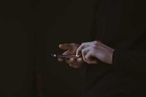 person, using, mobile, phone, dark, people, man, guy, texting, electronic, gadget, hand, touchscreen, men, mobile Phone, technology, business, businessman, holding, smart Phone, wireless Technology, human Hand, one Person, touch Screen, telephone, communication, text Messaging, internet, human body part, weapon, gun, indoors, studio shot, adult, black background, close-up, handgun, aiming, social issues, midsection, copy space, warning sign, aggression, human limb, 5K