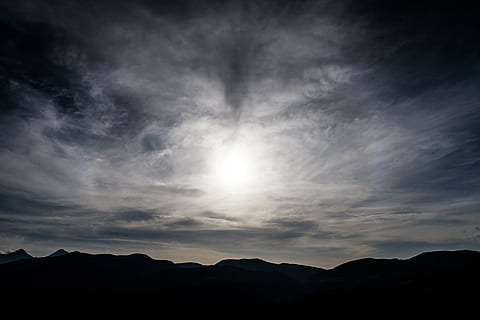 silhouette, mountain, white, clouds, cloudy, sky, highland, dark, sunset, nature, landscape, cloud - sky, beauty in nature, scenics, tranquil scene, no people, sun, mountain range, scenics - nature, dramatic sky, tranquility, environment, sunlight, cloudscape, idyllic, outdoors, bright, 5K
