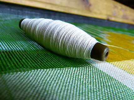 silk, yarn, thread spool, thread, weave, fabric, sewing, textile, spool, tailor, craft, material, close-up, textile Industry, wool, art and craft, no people, green color, still life, indoors, pattern, creativity, sewing item, selective focus, focus on foreground, table, 4K, CC0, public domain, royalty free