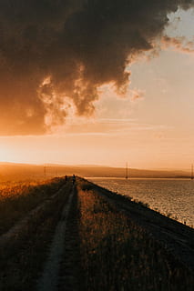 two, person, walking, road, daytime, ocean, cloud, sunset, path, track, coast, sky, cloud - sky, direction, tranquility, scenics - nature, tranquil scene, the way forward, water, beauty in nature, horizon, nature, land, diminishing perspective, sea, transportation, no people, horizon over water, outdoors, 5K, CC0, public domain, royalty free