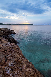 beach, blue waters, clouds, dawn, dusk, island, landscape, ocean, outdoors, reflection, rock, rocks, sand, sea, seascape, seashore, sky, summer, sun, sunrise, sunset, travel, water, scenics - nature, beauty in nature, cloud - sky, tranquility, tranquil scene, land, non-urban scene, idyllic, no people, rock - object, horizon, nature, solid, horizon over water, rocky coastline, 5K