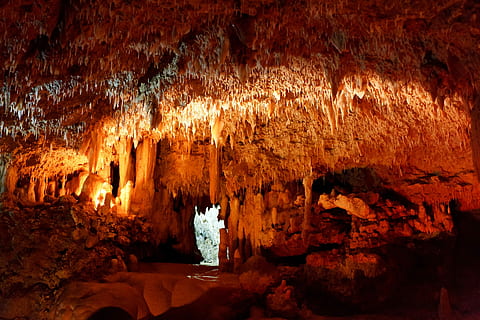 cavern across entrance, Cave, Cavern, Caving, Dark, Geology, inside, limestone, natural, nature, orange, rock, speleology, stalactite, stalagmite, stone, underground, wet, yellow, red, no people, travel destinations, beauty in nature, rock - object, rock formation, solid, physical geography, illuminated, indoors, travel, architecture, water, rough, textured, tranquility, eroded, 1080P, CC0, public domain, royalty free