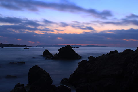silhouette photo, mountains, cliff, body, water, cloudy, sky, black, seashore, sunset, cloud, coast, ocean, sea, nature, coastline, beach, scenics, rock - Object, landscape, dusk, seascape, outdoors, beauty In Nature, blue, night, cloud - sky, silhouette, dramatic sky, rock, scenics - nature, tranquil scene, tranquility, solid, rock formation, idyllic, horizon over water, no people, non-urban scene, stack rock, purple, 5K, CC0, public domain, royalty free