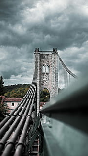gray, concrete, building, dark, sky, daytime, brooklyn bridge photography, bridge, stone, structure, cloud, tree, cloud - sky, built structure, architecture, bridge - man made structure, connection, nature, transportation, no people, travel destinations, building exterior, day, overcast, travel, tourism, city, outdoors, 4K, CC0, public domain, royalty free