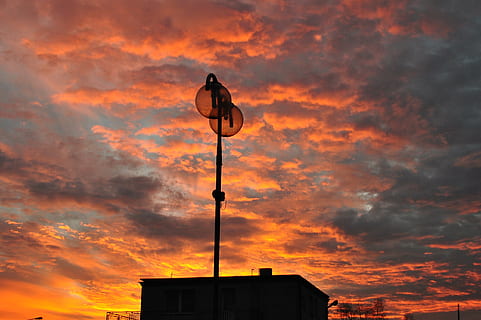 sunset, view, sky, clouds, evening, west, nature, yellow, landscapes, the sun, cloud - sky, orange color, low angle view, architecture, built structure, building exterior, silhouette, beauty in nature, no people, dramatic sky, outdoors, communication, scenics - nature, building, guidance, sign, 2K, CC0, public domain, royalty free